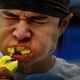 Man grimacing with a mouthful of Peeps